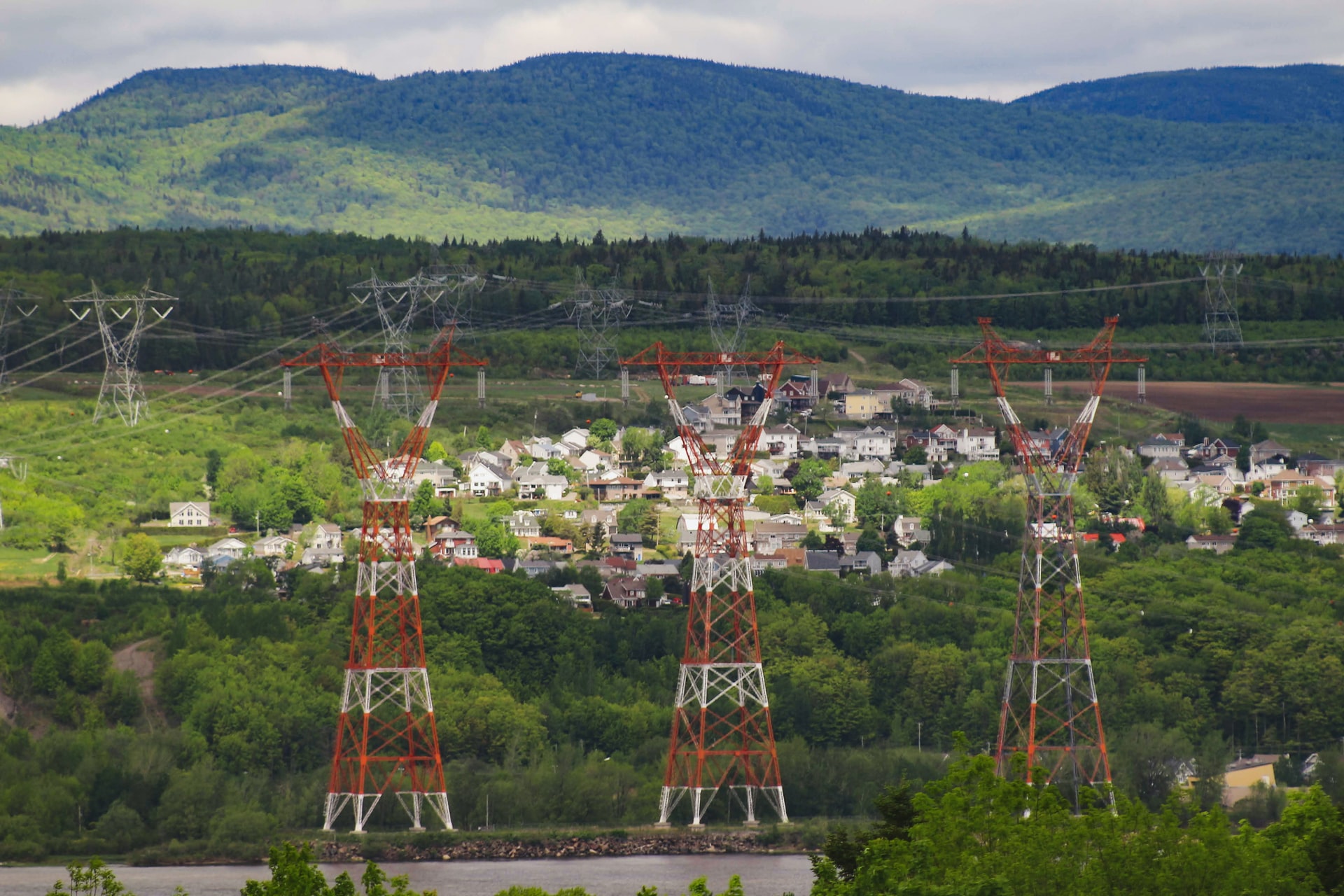 High voltage electrical grid pylons crossing the St. Lawrence River